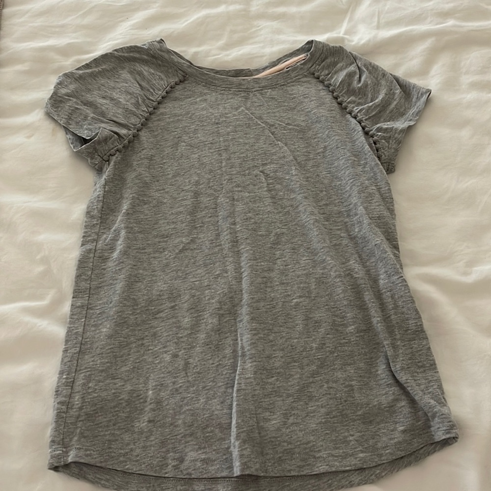 girls plain gray blouse/t-shirt with pompom detailing near sleeves